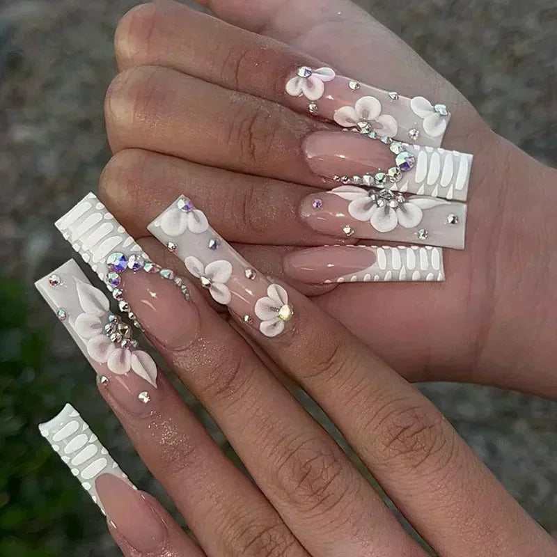 24 pieces long ballerina false nails with serpentine flower design and rhinestones, French style.