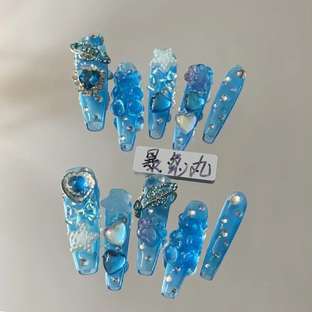 Blue 3D punk metal gothic press on nails with rhinestones and Hello Kitty stiletto camellia design.